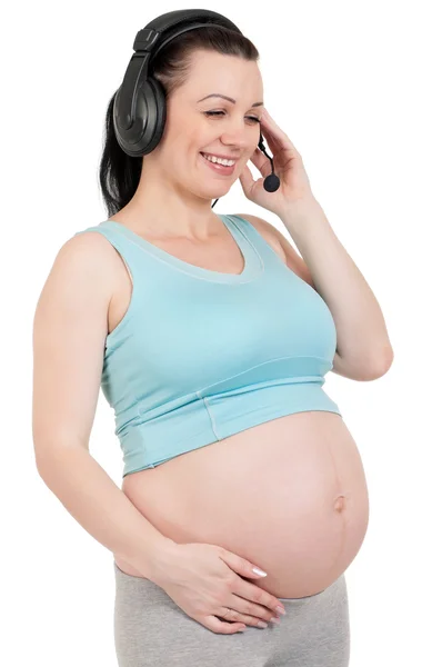 Gravid med hörlurar — Stockfoto