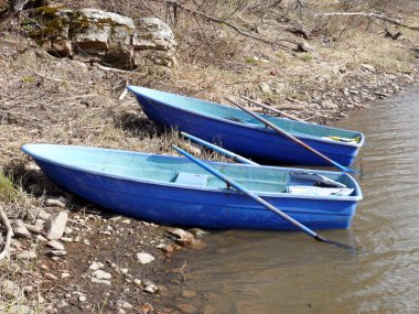 Two boats in stone coast. Satka river, Russia clipart