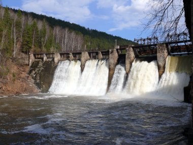Anthropogenic waterfall in satka river - village Porogi, Satka, Ural, Russi clipart