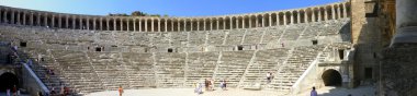 Aspendos, Turkey - September 04, 2008: Autumn day. Peoples walk in the old clipart