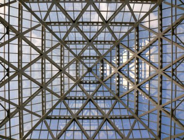 Glass roof in modern office building clipart