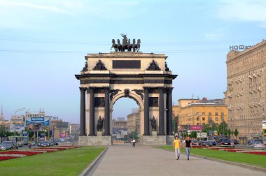 Moscow, Russia - June 26, 2010: Summer day. Peoples walk near the Triumphal clipart