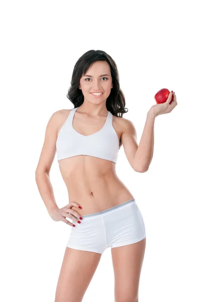 Yound ταιριάζει κοπέλα που κρατά κόκκινο μήλο — Φωτογραφία Αρχείου