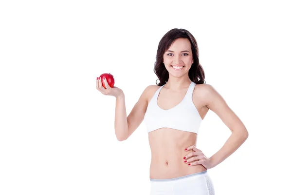 Yound chica en forma sosteniendo manzana roja — Foto de Stock