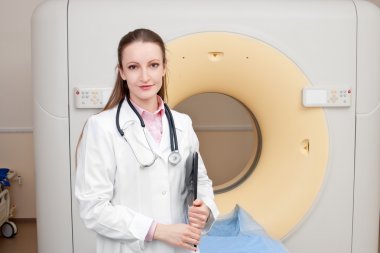 Woman Technologist with CT Scan Machine clipart