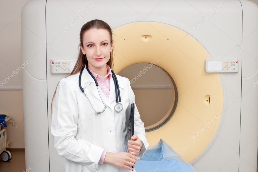 Woman Technologist with CT Scan Machine