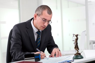 Lawyer on his workplace clipart