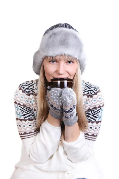 Beautifu woman in fur hat with a cup — Stock Photo, Image