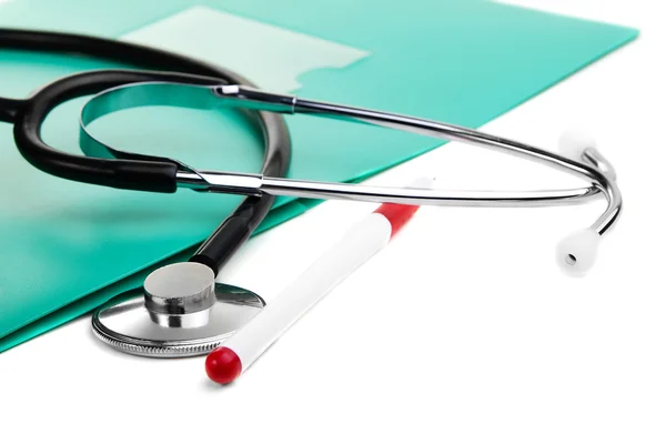 Stethoscope, pen and green folder for documents — Zdjęcie stockowe