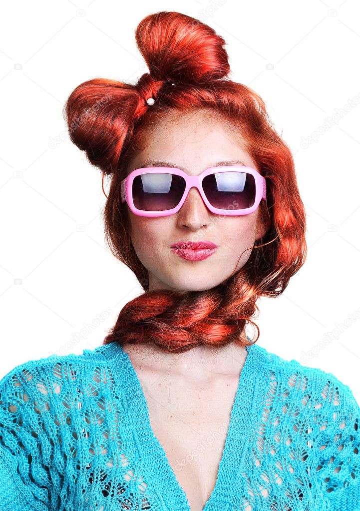 Fashion red-haired woman in a stylish glasses