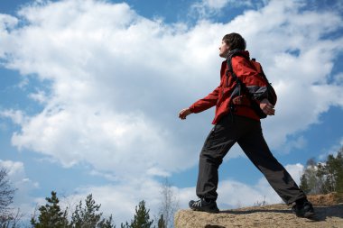 Traveler moves through the mountains clipart