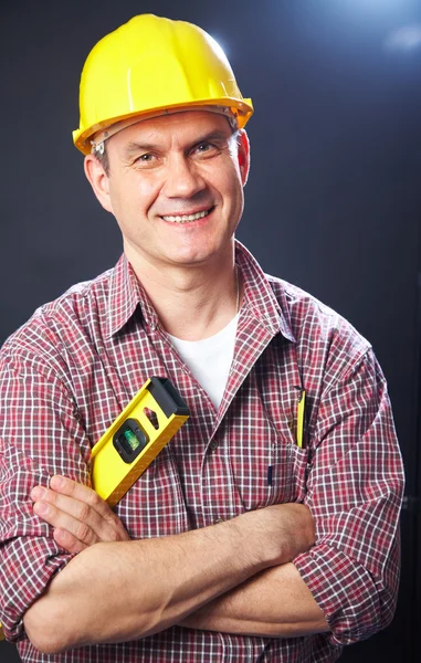 Builder on a dark background — Stock Photo, Image