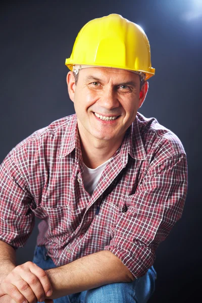 Builder on a dark background — Stock Photo, Image