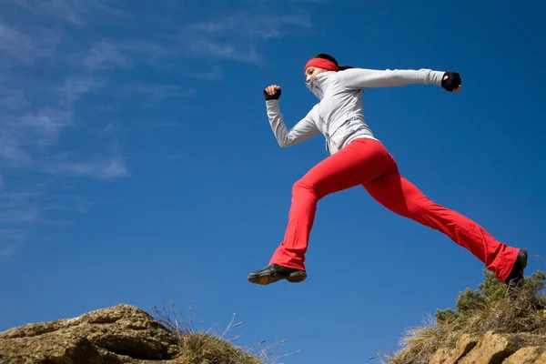 Jumping sporty woman — Stock Photo, Image