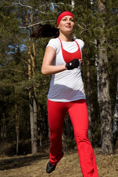 Běží krásná žena — Stock fotografie