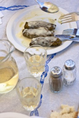Greek dolmades on a dish clipart