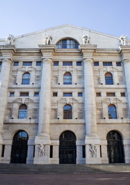 Palazzo della borsa. Exchange building on dramatic sky, Milan