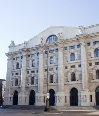 Palazzo della borsa. Exchange building on dramatic sky, Milan