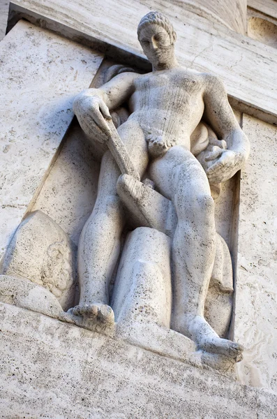 Man statue of the exchange building of Milan — Stock Photo, Image