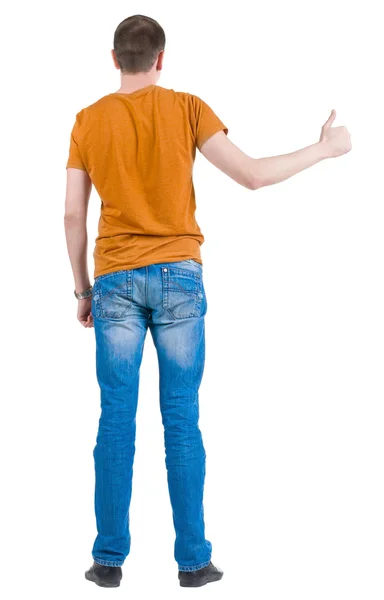 Back view of young men in orange t-shirt going thumb up. — Stock Photo, Image