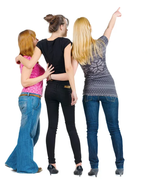 Back view of group beautiful women pointing at wall — Stock Photo, Image