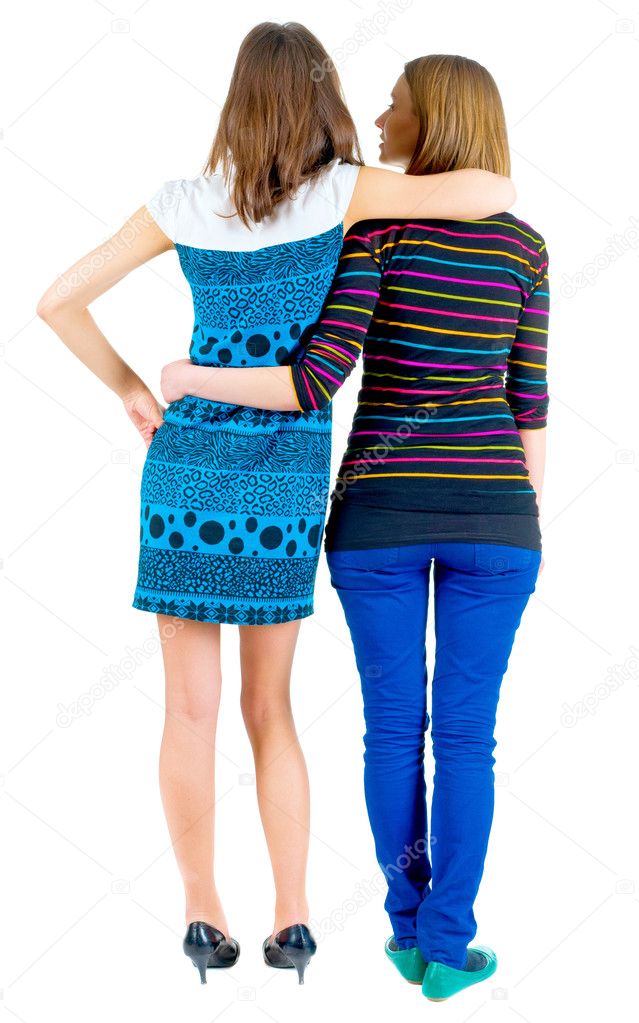 Back view of two young brunette standing woman