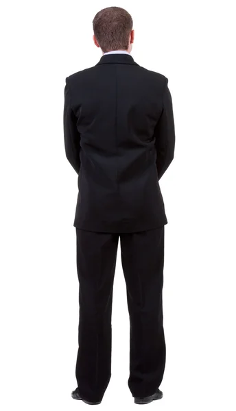 Vista posterior de joven en traje negro observando. —  Fotos de Stock