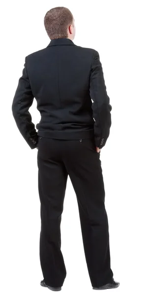 Vista di un uomo adulto in abito nero guardando posteriore. — Foto Stock