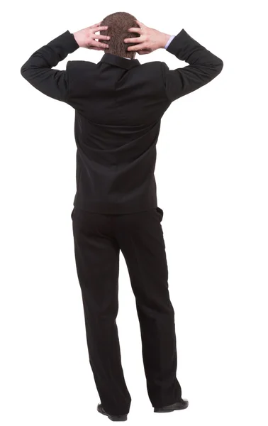 Vista posterior de hombre de negocios sorprendida en traje negro — Foto de Stock