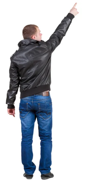 Widok człowieka wskazujące w dżinsy i kurtka z tyłu. — Zdjęcie stockowe
