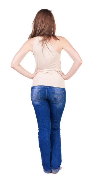 Back view of beautiful yong woman looks ahead. rear view. — Stock Photo, Image