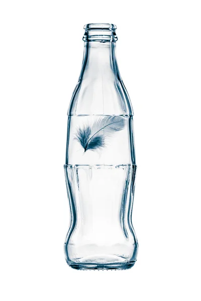 Bottle with feather — Stock Photo, Image