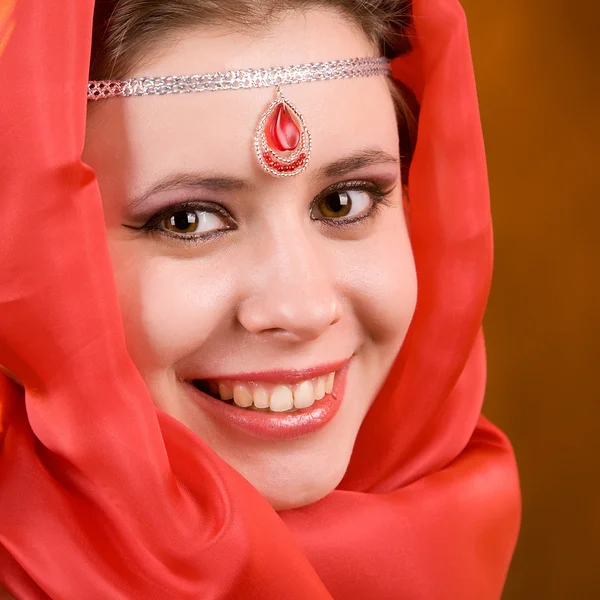 Woman in a red scarf — Stock Photo, Image