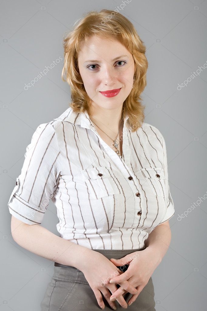 Blonde attractive woman with large breasts in a striped shirt