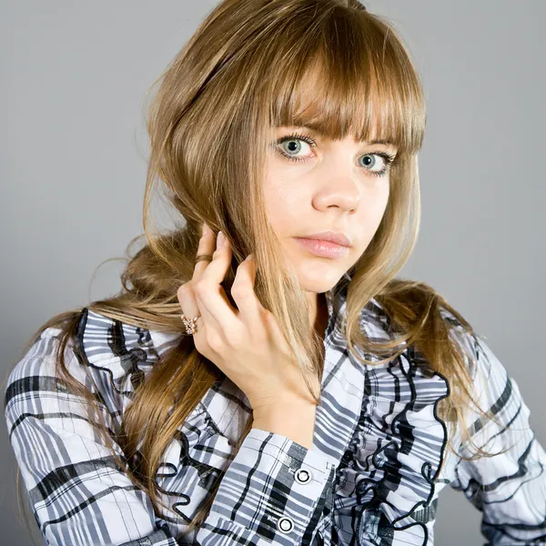 Girl in a checkered shirt — Stock Photo, Image