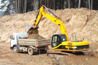 Backhoe loader loading dumper clipart