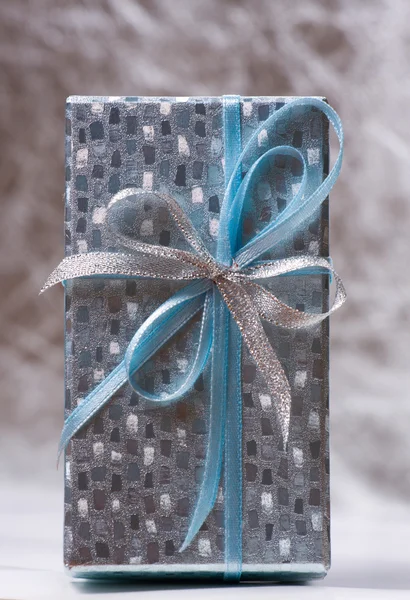 Stock image Mood shot of luxurious gift box on silver background