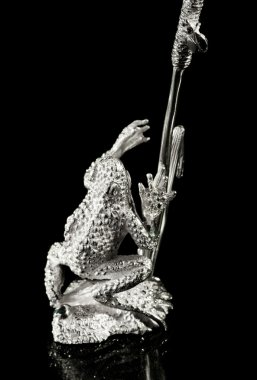 Silver sculpture of a frog clipart