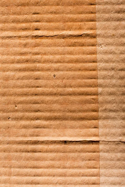 Textured recycled cardboard with natural fiber parts — Stock Photo, Image