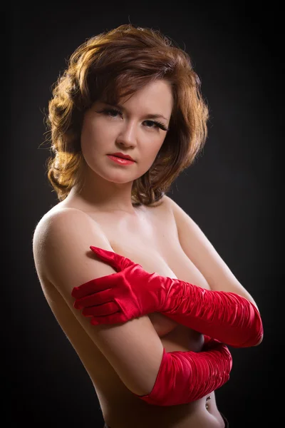 The elegant girl in red gloves/ — Zdjęcie stockowe