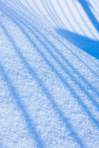 Hintergrund aus Schnee, der mit der Sonne schien — Stockfoto