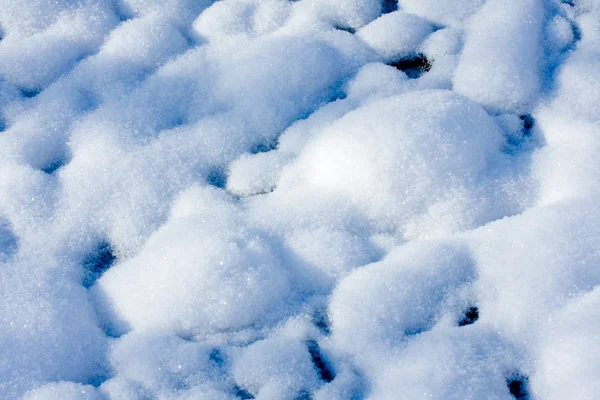 Фон из снега, сияющий солнцем — стоковое фото