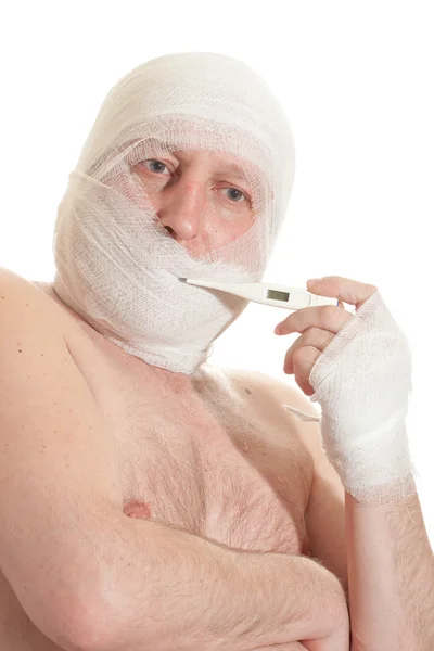 stock image Man with bandage on head. Looking unhappy at something.