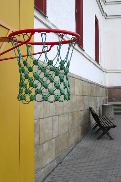 stock image Basketball against a background of an empty school yard