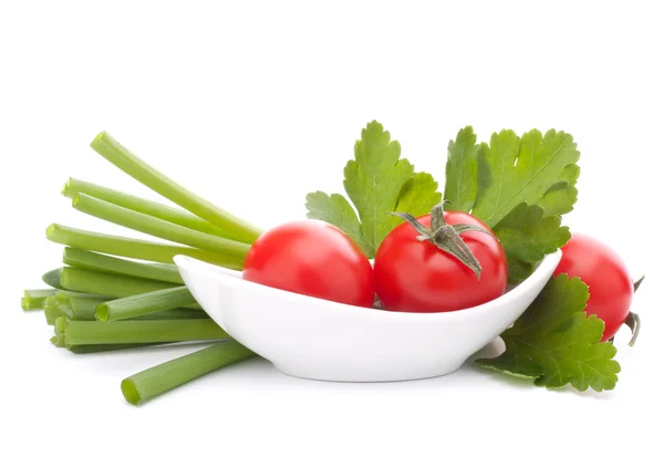 stock image Spring onions and cherry tomato in bowl