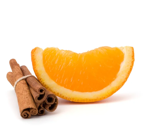 stock image Orange fruit segment and cinnamon sticks isolated on white back