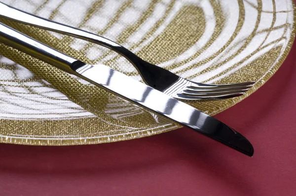 stock image Fork and knife on a plate