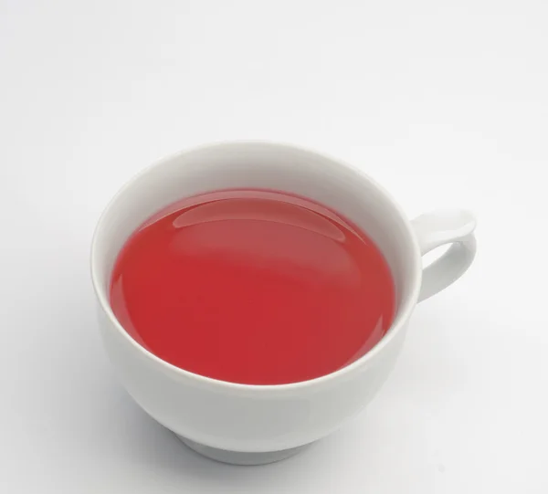 Chá de frutas em uma xícara branca — Fotografia de Stock