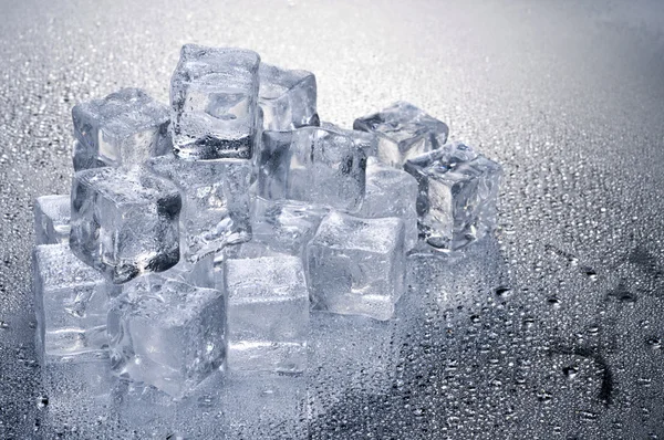 stock image Ice cubes over wet background