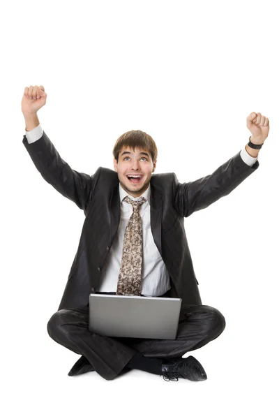 Framgångsrik affärsman med laptop isolerad på vit — Stockfoto
